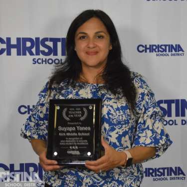 Photo of Suyapa Yanes Teacher of the Year Kirk MS with award